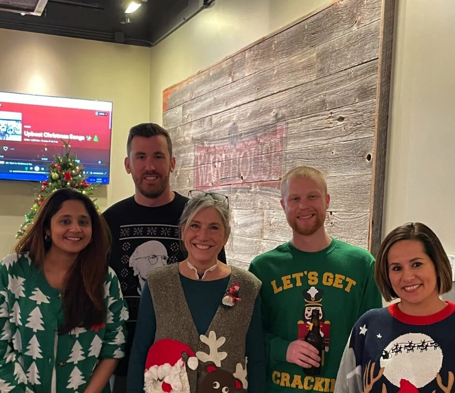FCL team wearing christmas sweaters