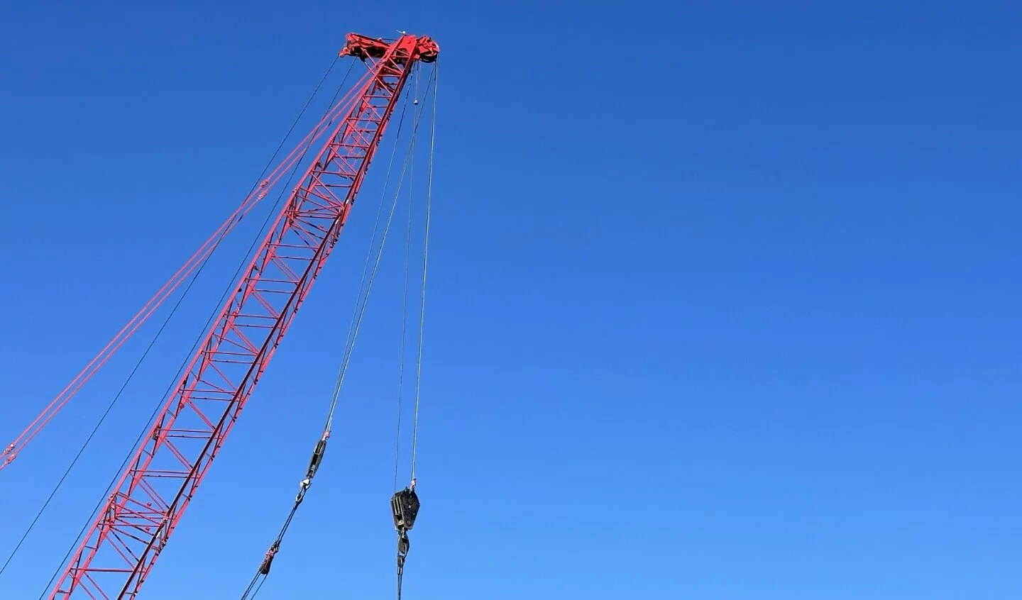 Photo of Crane with the sky background, photo taken on a sunny day.