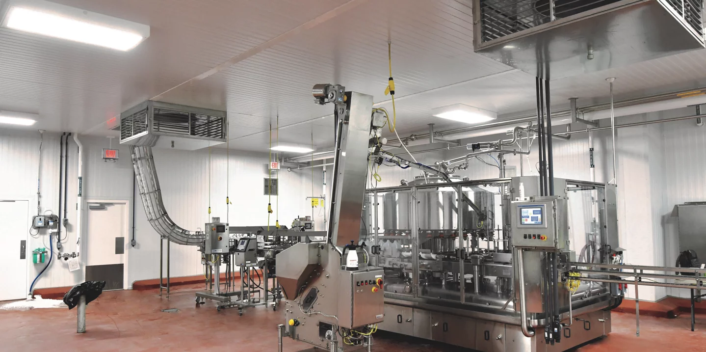 Interior Dairy Maid Facility, specialized machinery, red floor, vents, white walls.