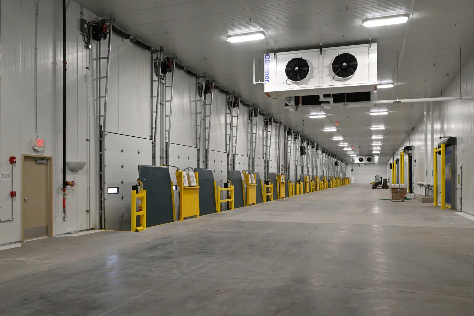 interior distribution warehouse, multiple rows of distribution bays, concrete floors.