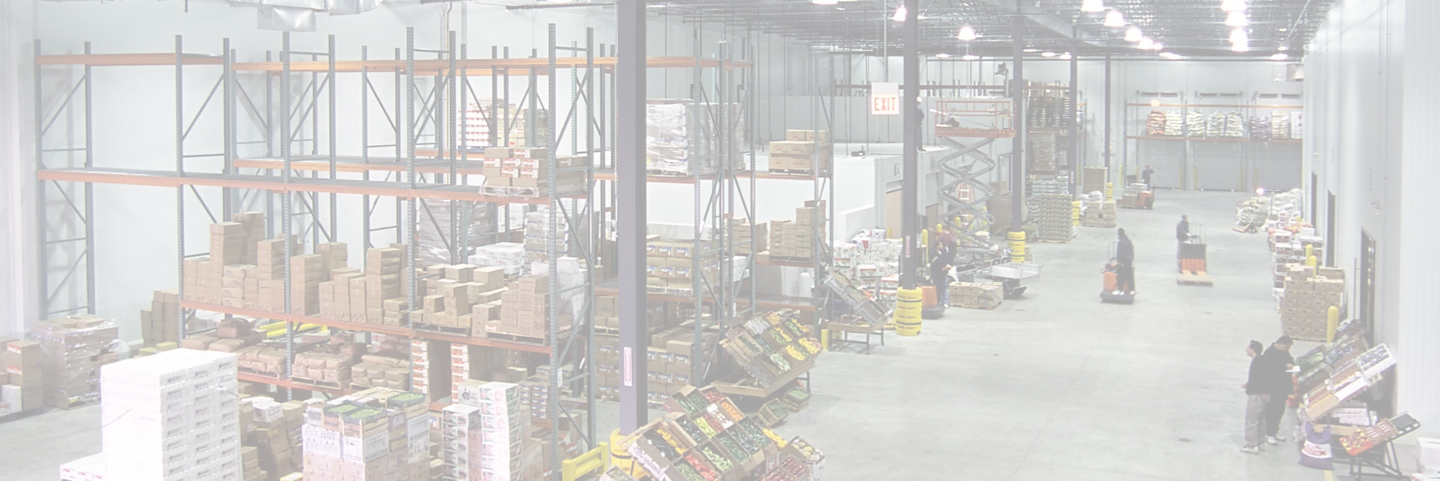 Chicago International Produce Cold storage facility interior, shelving of food and produce, boxes, warehouse employees working.