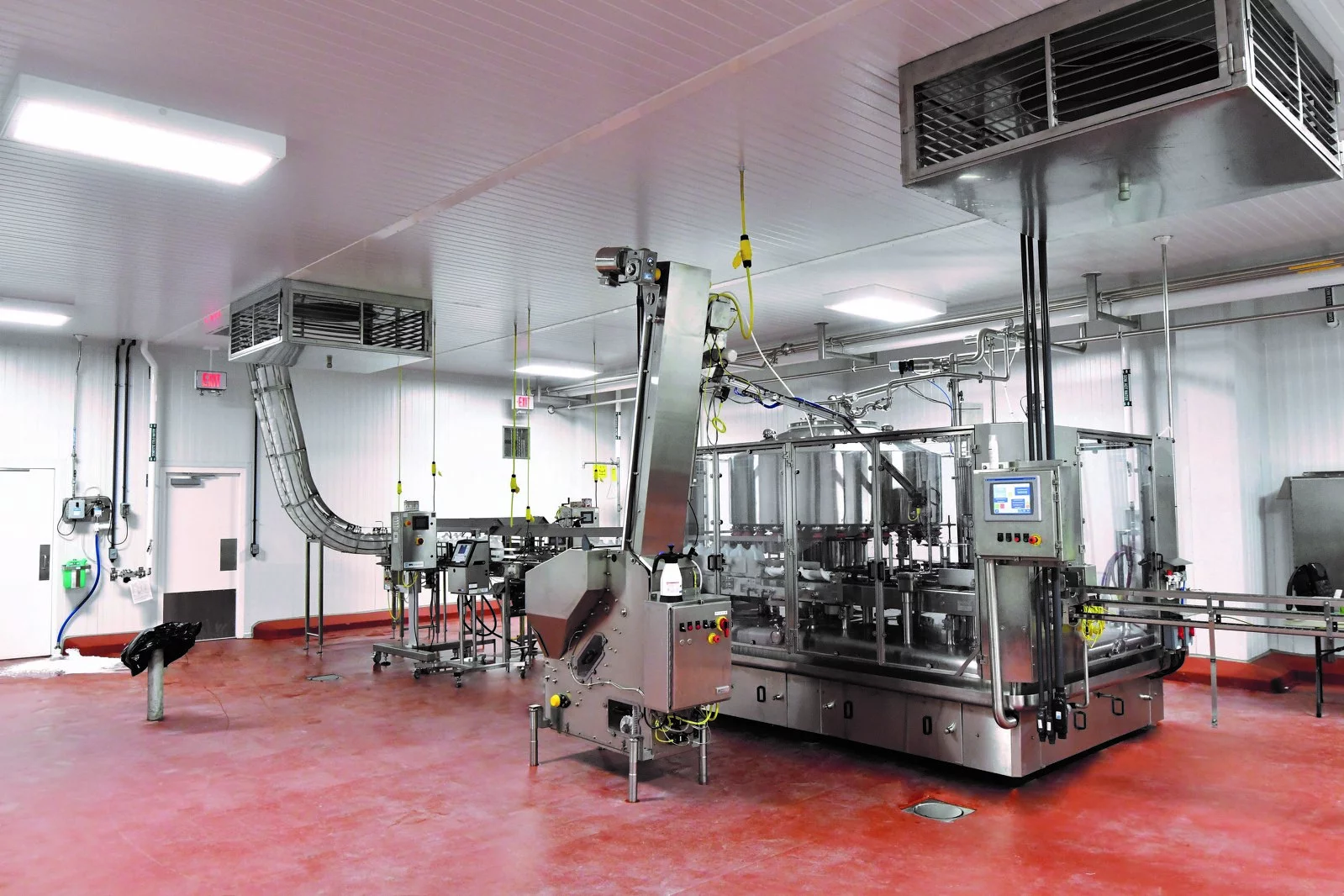 Interior Dairy Maid Facility, specialized machinery, red floor, vents, white walls.