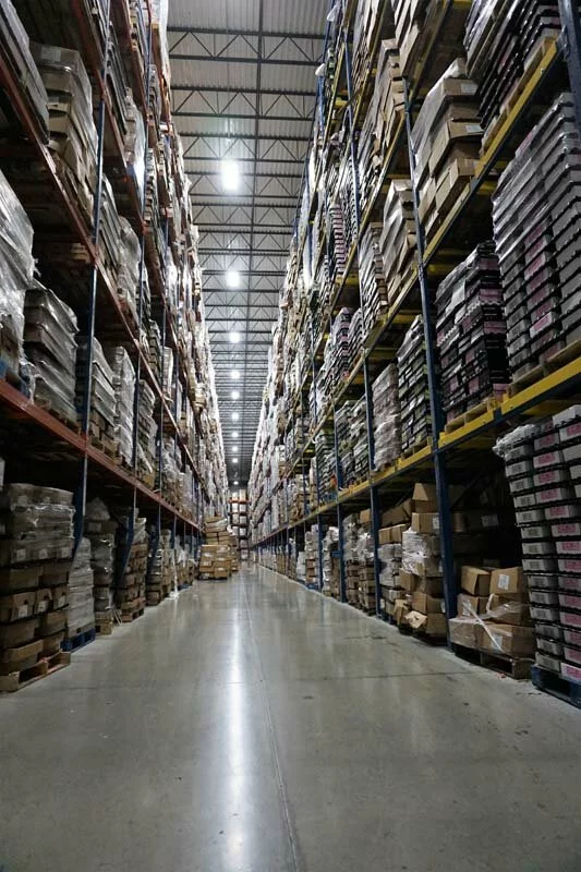 warehouse interior, large shelving units.
